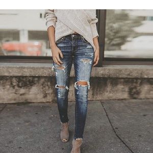 High waisted distressed jeans